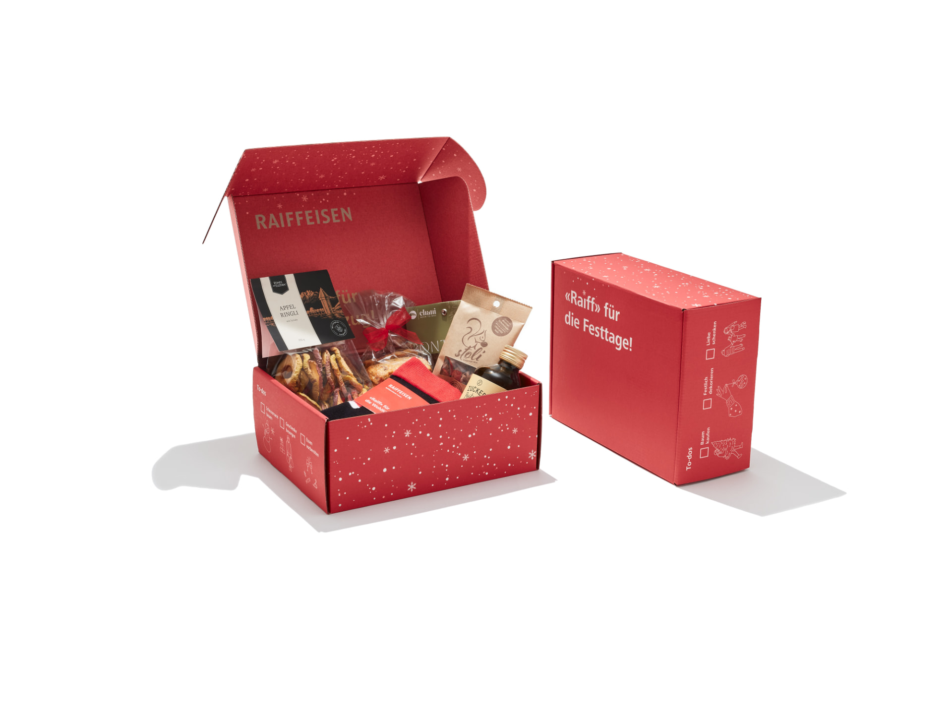 Rote Weihnachts-Geschenkbox für Kundinnen und Kunden im Corporate Design